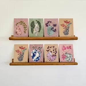 Illustrated postcards featuring flowers and plants in ceramic vases, inspired by Japanese art.
